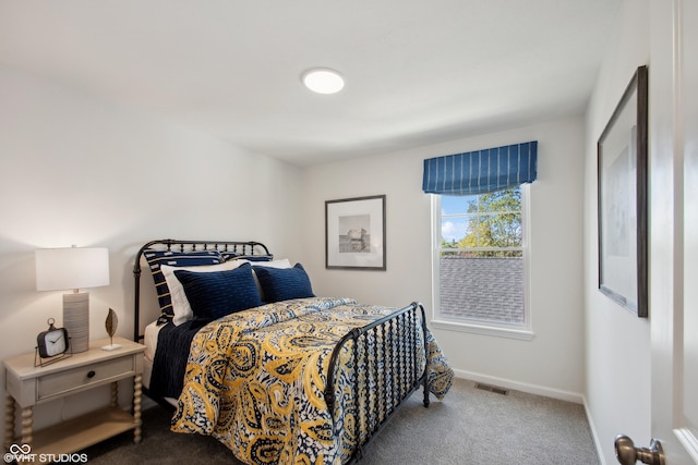 bedroom with carpet flooring, visible vents, and baseboards