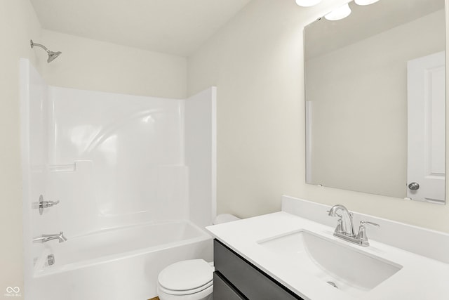 bathroom featuring vanity, toilet, and shower / bathtub combination