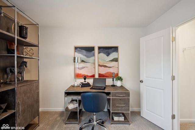 carpeted office space with baseboards