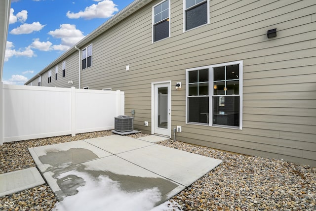 back of property featuring a patio area, fence, and cooling unit