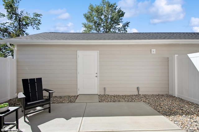 view of outbuilding featuring fence