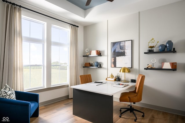 office area featuring wood finished floors, a ceiling fan, and baseboards