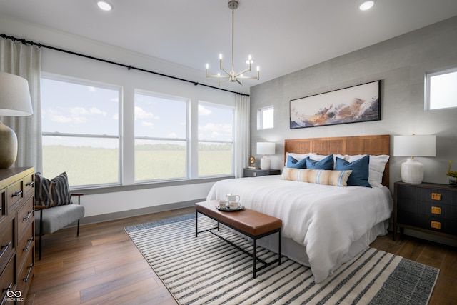 bedroom featuring a chandelier, dark wood-style flooring, baseboards, and recessed lighting