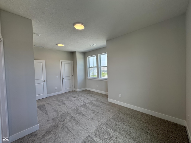 15871 Vitalize Run, Fishers, IN 46040 - unfurnished bedroom featuring carpet flooring, baseboards, and a textured ceiling