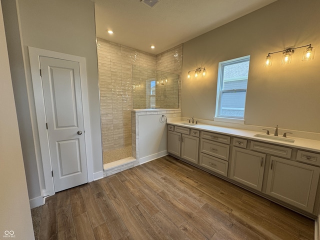 15871 Vitalize Run, Fishers, IN 46040 - bathroom featuring a walk in shower, wood finished floors, and double vanity