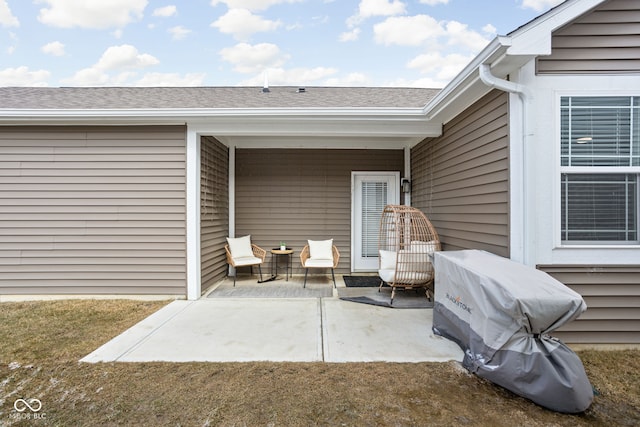 view of patio featuring a grill