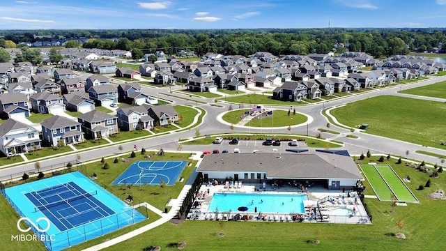 birds eye view of property with a residential view