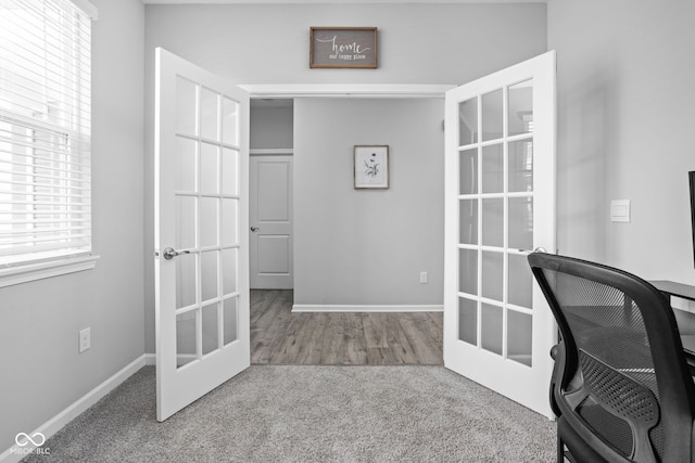 carpeted office featuring baseboards and french doors