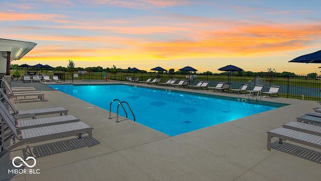 pool featuring a patio area and fence