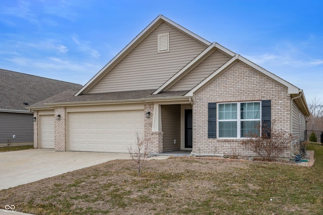 view of front of house featuring an attached garage, concrete driveway, and brick siding