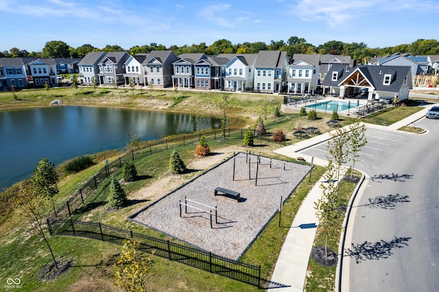 birds eye view of property featuring a residential view and a water view