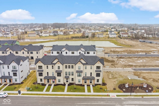 birds eye view of property with a residential view