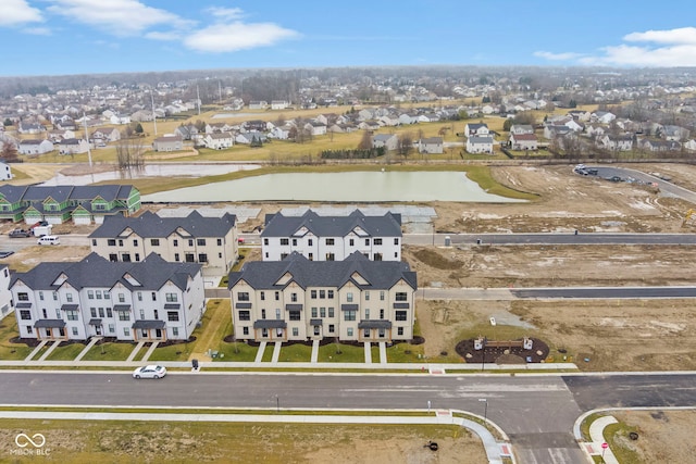 birds eye view of property with a water view and a residential view