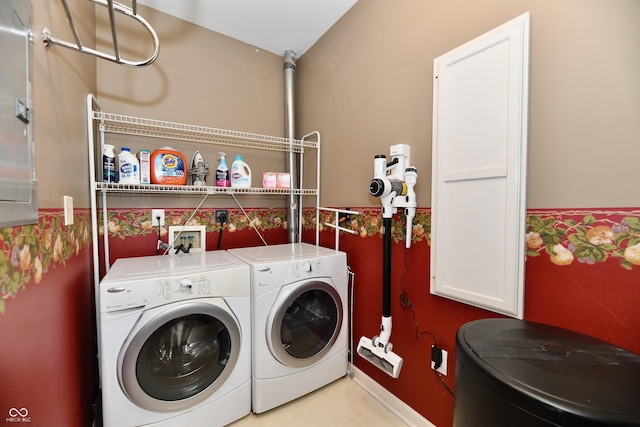 clothes washing area with independent washer and dryer and laundry area