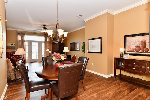 dining room featuring baseboards, crown molding, an inviting chandelier, and wood finished floors