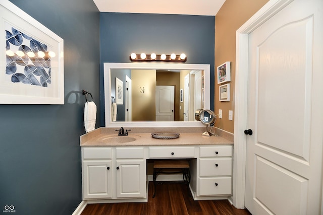 bathroom with vanity and wood finished floors