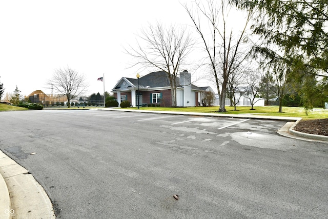 view of street featuring curbs and sidewalks