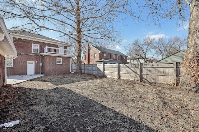 3645 N Delaware St, Indianapolis, IN 46205 - view of yard featuring a patio, a balcony, and a fenced backyard