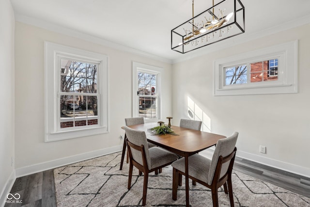 3645 N Delaware St, Indianapolis, IN 46205 - dining area with wood finished floors, a healthy amount of sunlight, and ornamental molding
