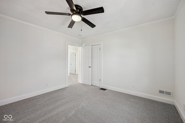 3645 N Delaware St, Indianapolis, IN 46205 - carpeted spare room featuring visible vents, baseboards, and ornamental molding