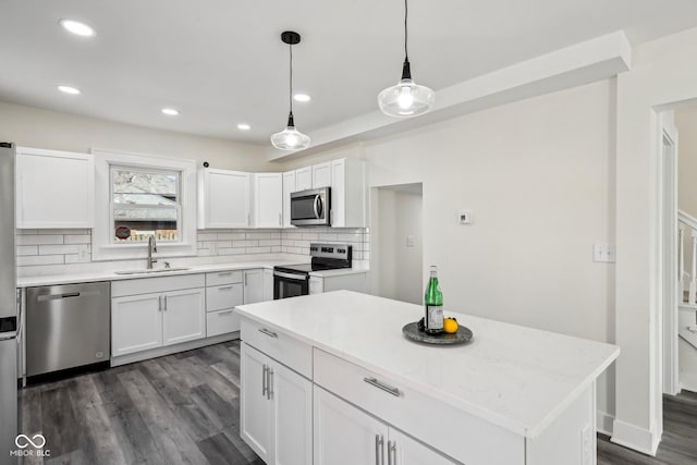 3645 N Delaware St, Indianapolis, IN 46205 - kitchen with a sink, decorative backsplash, appliances with stainless steel finishes, and white cabinets