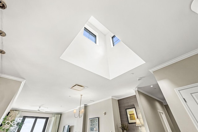 interior details with a ceiling fan and crown molding