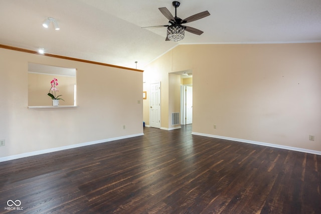 empty room with visible vents, dark wood-type flooring, a ceiling fan, vaulted ceiling, and baseboards