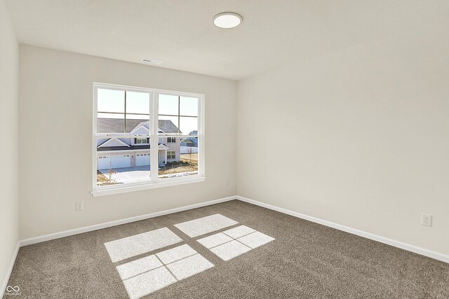 7168 Jackson Dr, Cumberland, IN 46229 - empty room with visible vents, baseboards, and carpet floors