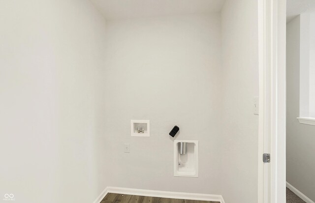 7168 Jackson Dr, Cumberland, IN 46229 - clothes washing area featuring hookup for a washing machine, baseboards, and dark wood-style flooring