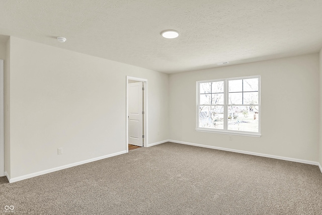 7168 Jackson Dr, Cumberland, IN 46229 - unfurnished room with carpet flooring, visible vents, a textured ceiling, and baseboards