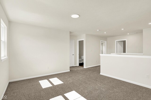 7168 Jackson Dr, Cumberland, IN 46229 - spare room with recessed lighting, baseboards, and dark carpet