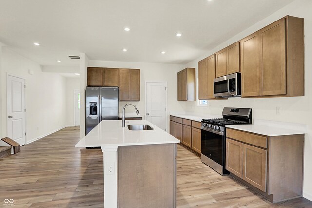 7168 Jackson Dr, Cumberland, IN 46229 - kitchen featuring a sink, stainless steel appliances, light wood-type flooring, and recessed lighting
