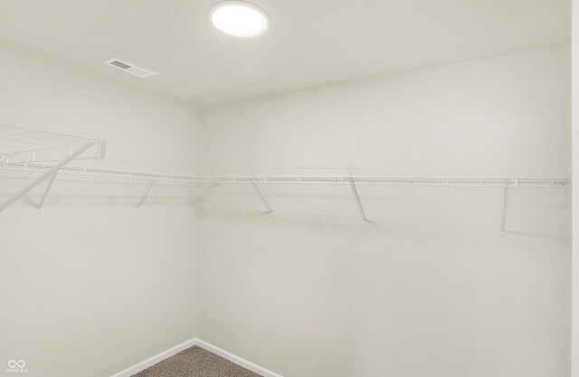 7168 Jackson Dr, Cumberland, IN 46229 - walk in closet with visible vents and carpet