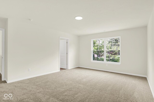 7168 Jackson Dr, Cumberland, IN 46229 - carpeted spare room with baseboards and a smoke detector