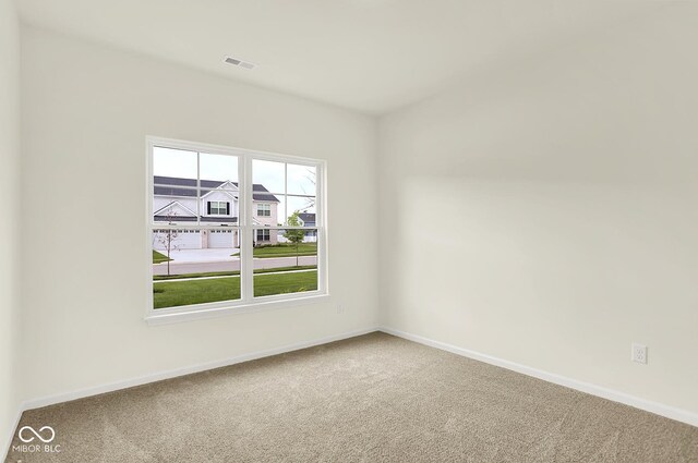 7168 Jackson Dr, Cumberland, IN 46229 - empty room with carpet flooring and baseboards
