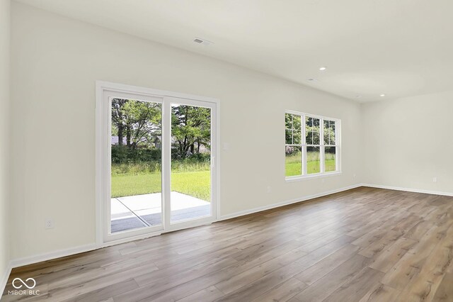 7168 Jackson Dr, Cumberland, IN 46229 - spare room featuring wood finished floors and recessed lighting