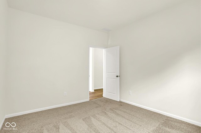 7168 Jackson Dr, Cumberland, IN 46229 - carpeted empty room with baseboards