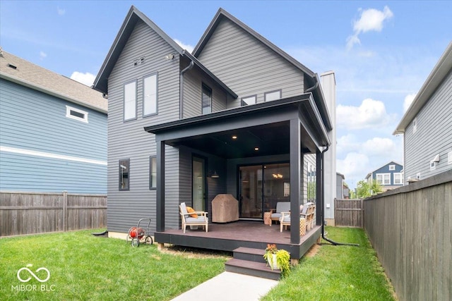2026 Alvord St, Indianapolis, IN 46202 - back of property with a yard, a wooden deck, and a fenced backyard