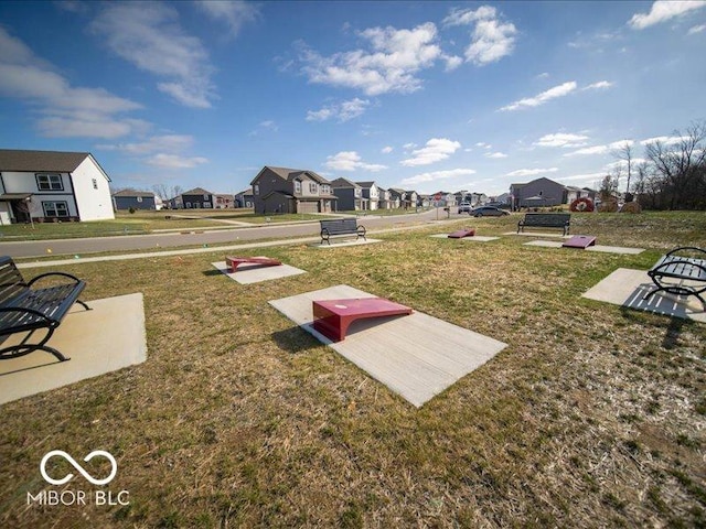 exterior space with a lawn and a residential view