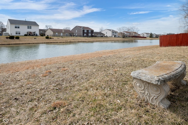 water view with fence and a residential view