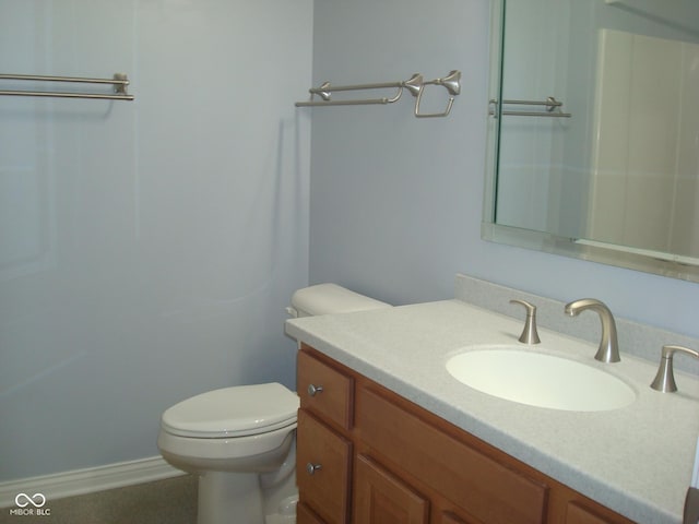 bathroom with toilet and vanity