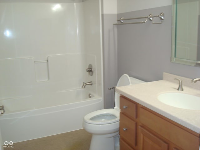 bathroom featuring vanity, toilet, and bathing tub / shower combination