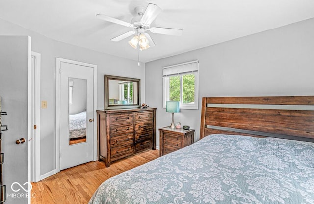 bedroom featuring light wood-style flooring and a ceiling fan