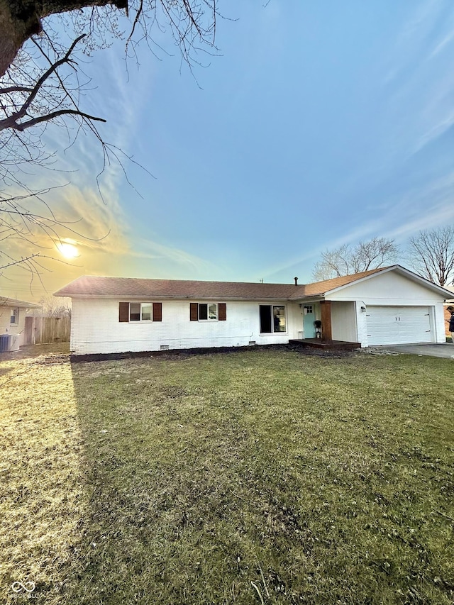 single story home with a front lawn, an attached garage, and fence