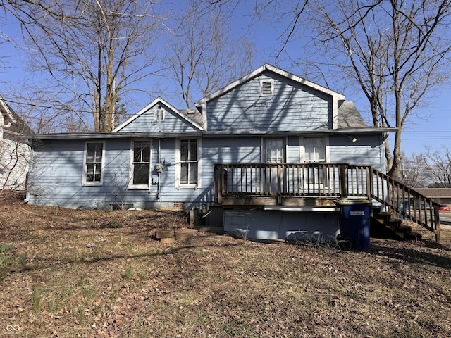 view of front of property with stairway and a wooden deck