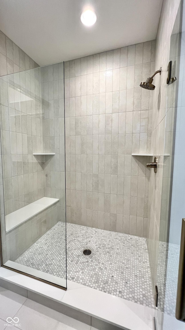 bathroom featuring a shower stall