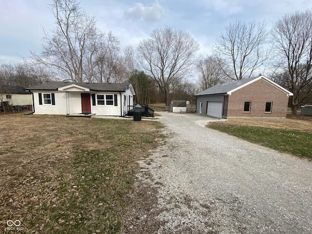 exterior space with gravel driveway