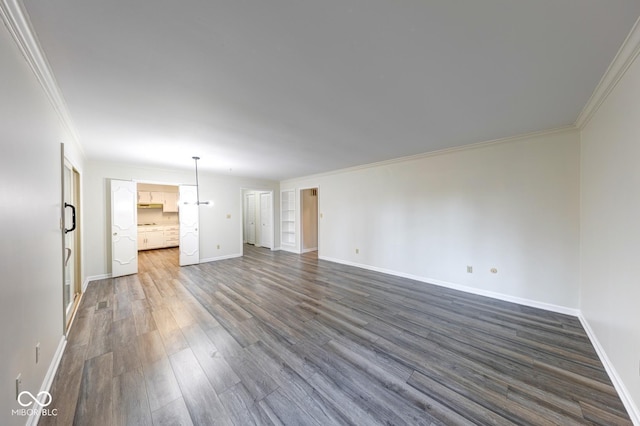 interior space with dark wood-style floors, baseboards, and crown molding