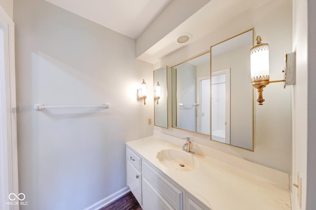 bathroom with vanity and baseboards