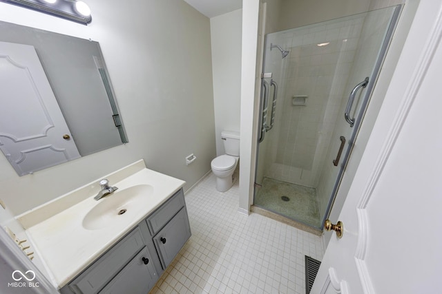 full bath with toilet, a stall shower, tile patterned floors, and vanity